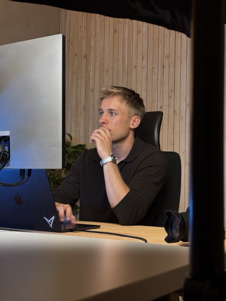 Alex Bossert focused at his desk